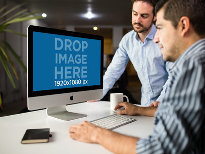 Two Men at the Office Using an iMac Mockup a16261